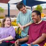 People with a disability smiling and laughing